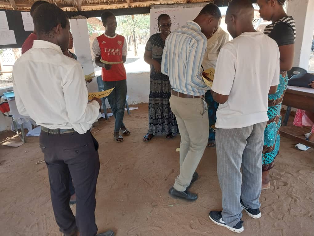 A man teaching young students